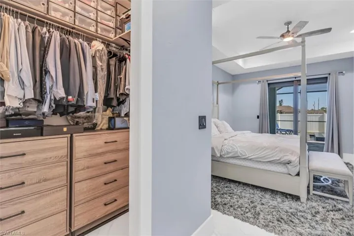 Bedroom with access to exterior and baseboards