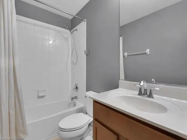 Bathroom featuring vanity and shower / bath combo