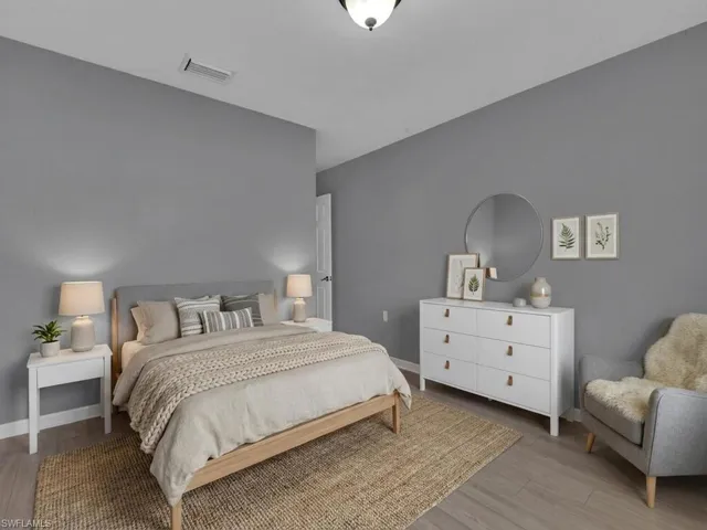 Bedroom with light wood-type flooring and baseboards