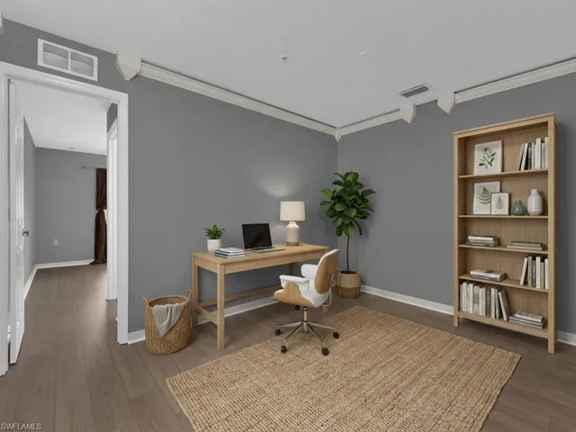 Home office with crown molding and wood finished floors