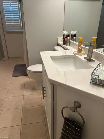 Guest bathroom with exit door to pool , outside area