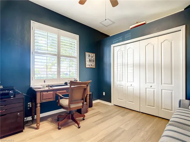 Den or 4th bedroom with closet and decorative plank flooring
