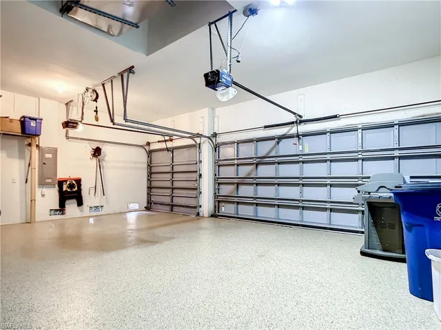 3 Car garage with sleek epoxy flooring