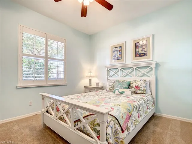 3rd private guest bedroom , plantation shutters and decorative ceiling fan