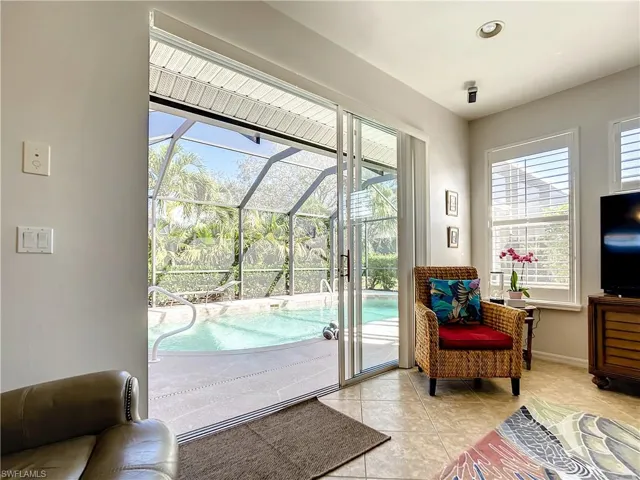 Family room with sliders leading out to pool