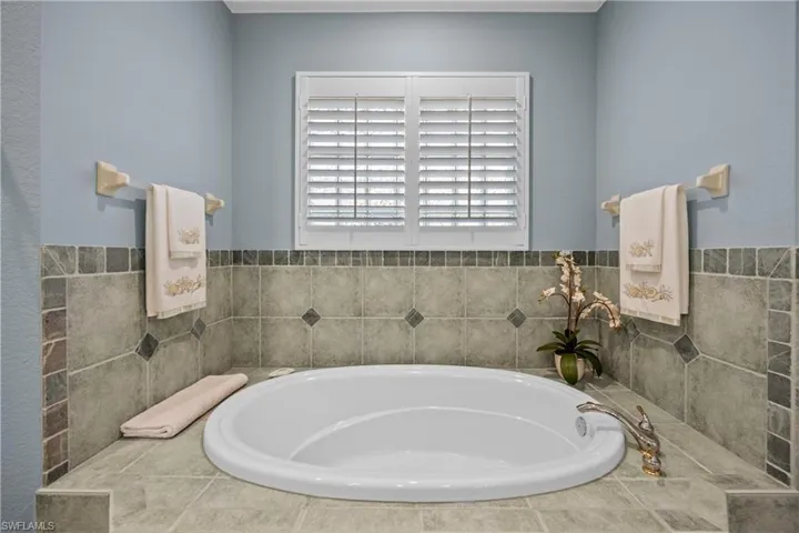 Bathroom featuring a relaxing tiled tub