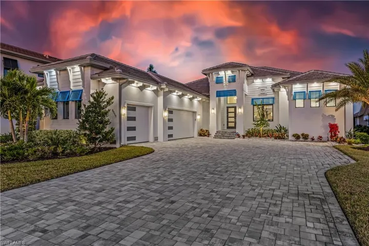 Mediterranean / spanish-style home with a garage