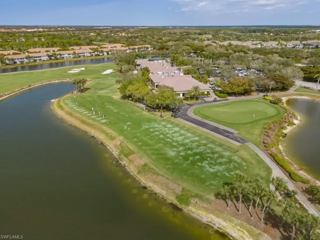 Aerial overview of property's location featuring a nearby body of water and nearby suburban area