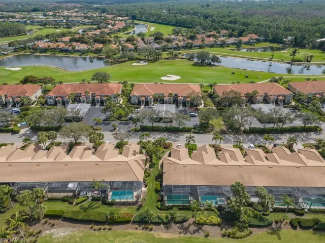 View of property location with a golf club and nearby suburban area
