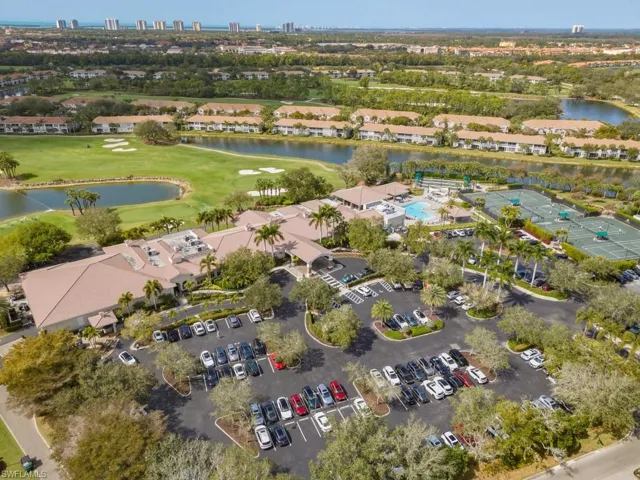 View of property location featuring a golf club and a large body of water
