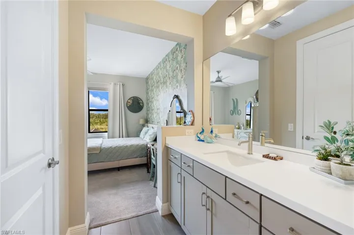 Bathroom featuring ceiling fan and vanity