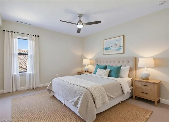 Bedroom with carpet and ceiling fan