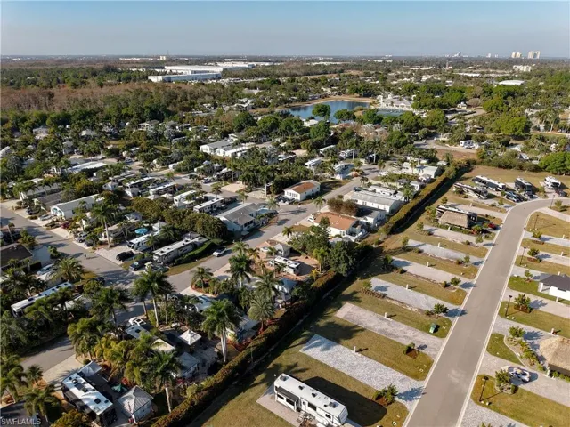Aerial overview of property's location featuring nearby suburban area and a nearby body of water