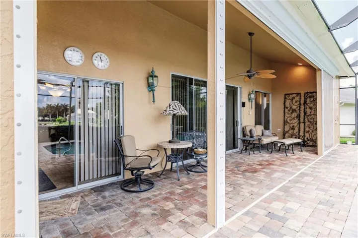 View of patio featuring ceiling fan