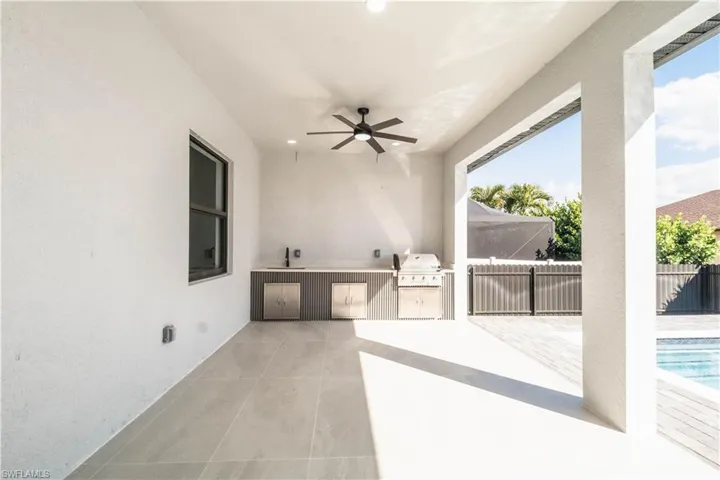 View of patio / terrace with an outdoor kitchen and ceiling fan