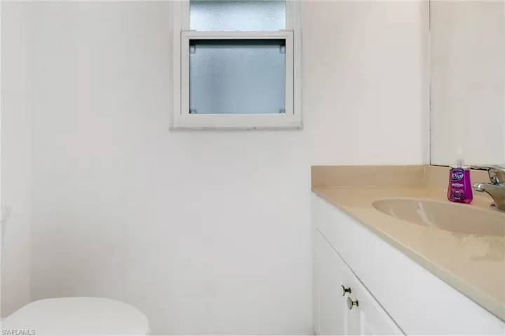 Bathroom featuring vanity and toilet