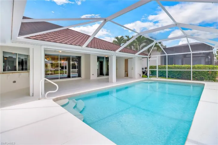 View of pool featuring a patio and a lanai