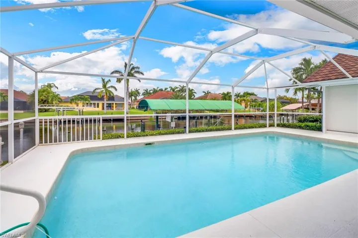 View of pool with glass enclosure
