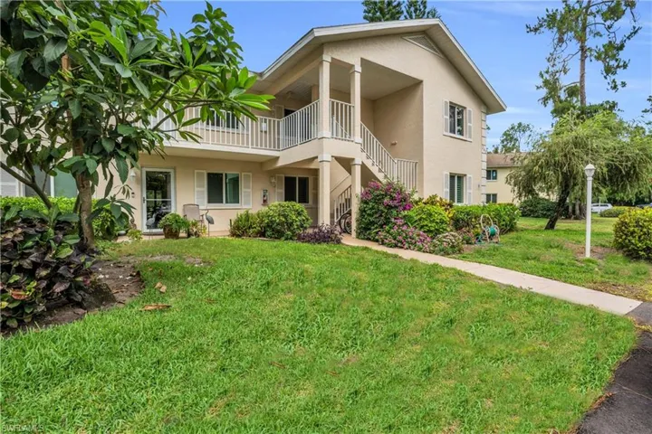 View of front of property with a front yard