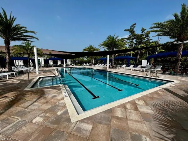 Community pool featuring a patio