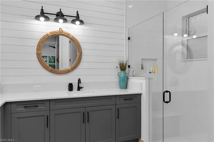 Full bath featuring vanity and a stall shower
