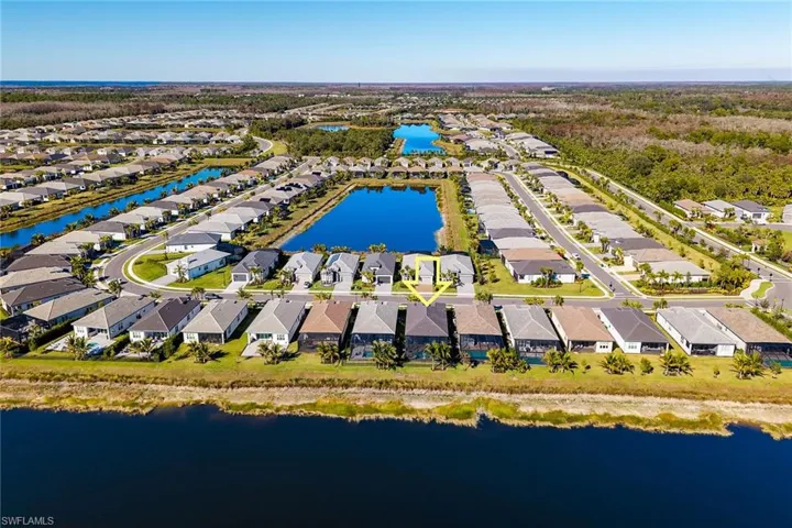 Aerial view of residential area with a large body of water