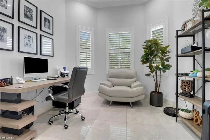 Office featuring baseboards and light tile patterned flooring