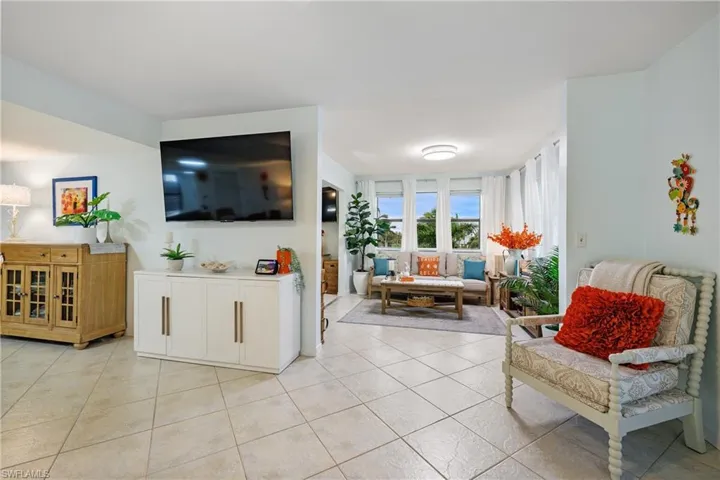 Living room with light tile patterned floors