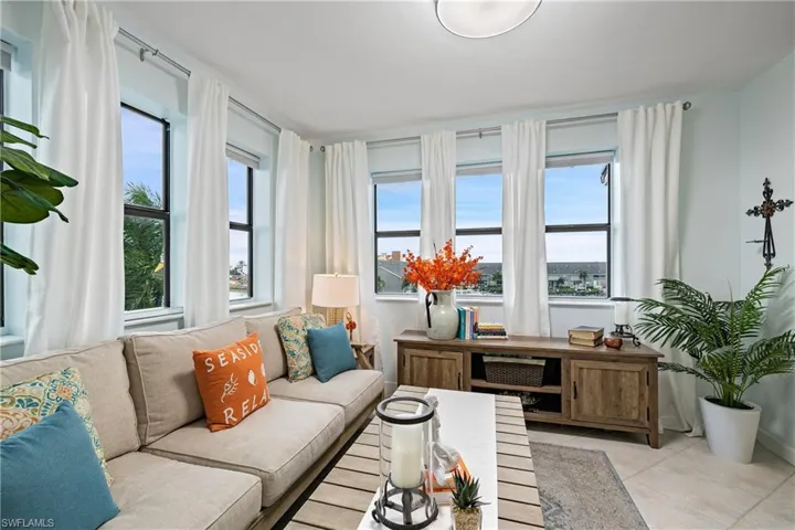 Living room with light tile patterned floors