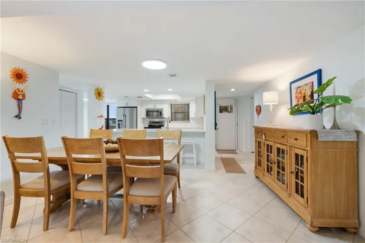 Dining area featuring light tile patterned flooring