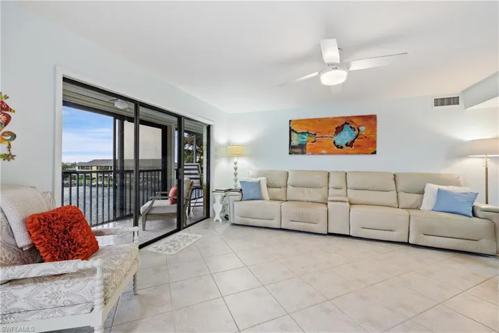 Tiled living room with ceiling fan