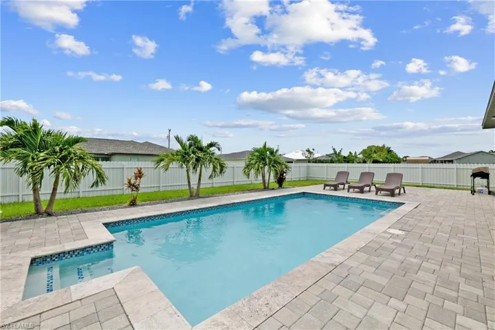 View of swimming pool featuring a fenced backyard and a patio area