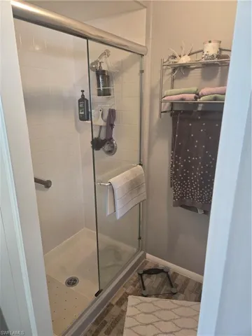 Bathroom with a shower with door
