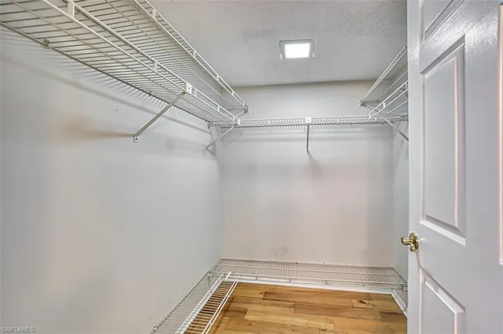Walk in closet featuring light wood finished floors