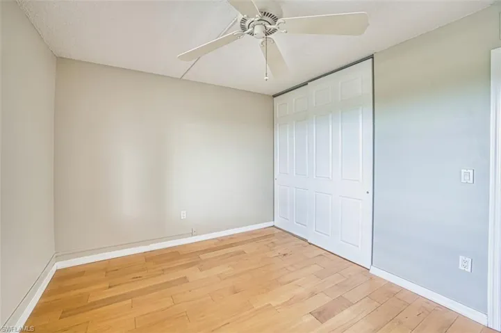 2nd Bedroom featuring light wood-type flooring, a ceiling fan, a closet, and a textured ceiling