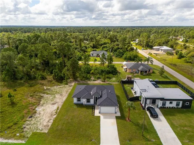 View of subject property featuring a heavily wooded area