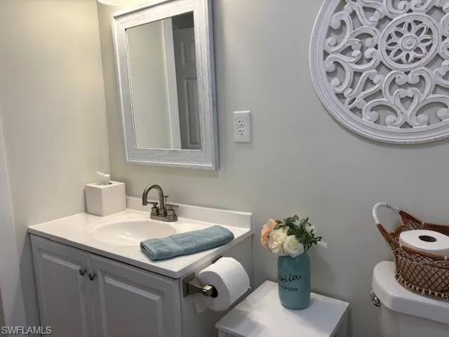 Half bath with toilet and vanity