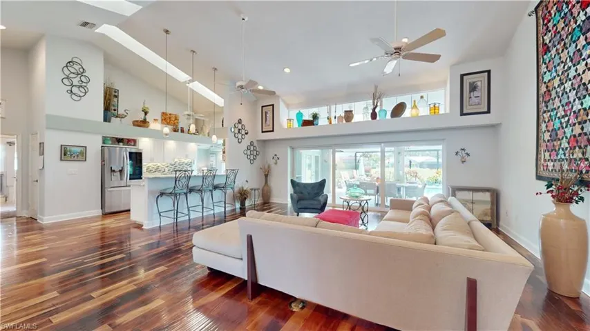 Transom Windows, skylights in kitchen, breakfast bar & acacia floors.