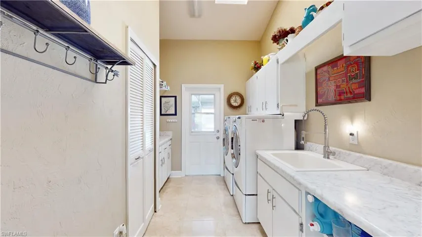 Laundry room with door to garage.
