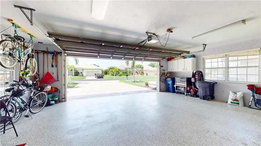 Oversized two car garage with room for golf cart and storage.