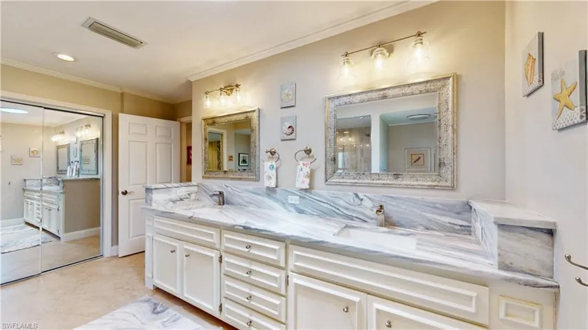 Double sinks, large Mirrored closet, lots of storage