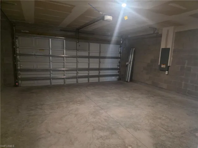 Garage with concrete block wall and electric panel