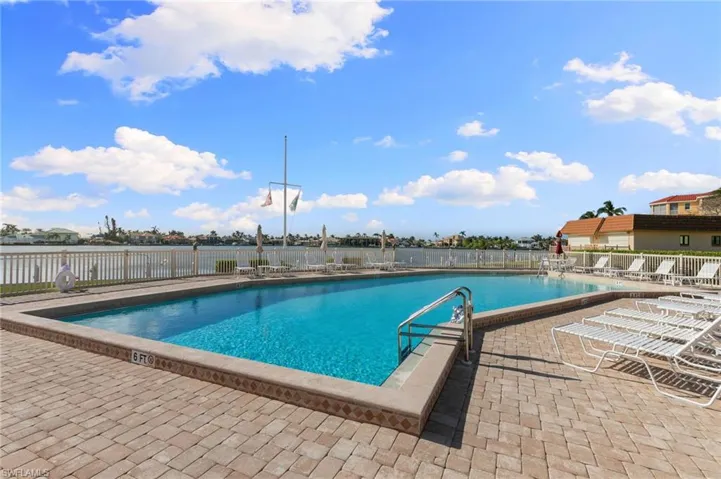 Community pool with a patio area