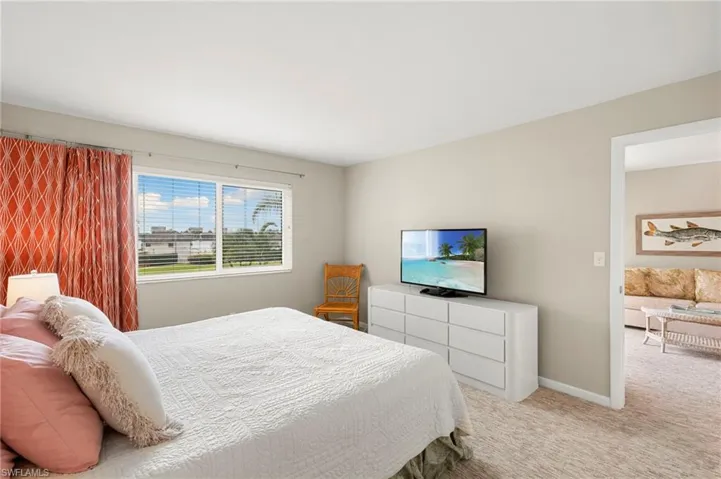 Bedroom with carpet and baseboards