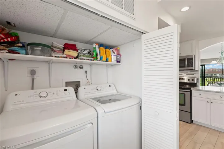 Laundry room with washing machine and dryer
