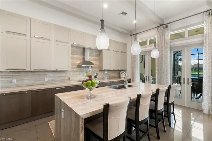Chef-inspired kitchen with over-size island, upgraded cabinetry, and open living flow.