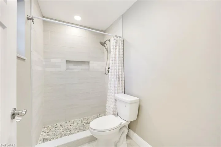 Primary bathroom features a walk-in shower.