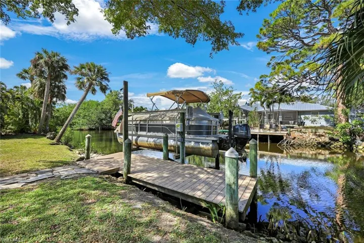 Home features a 10,000 pound boat lift.