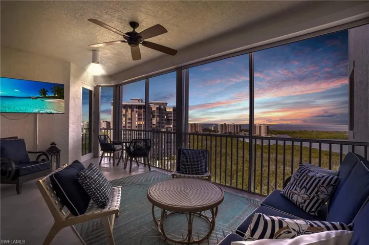 Sunroom featuring ceiling fan