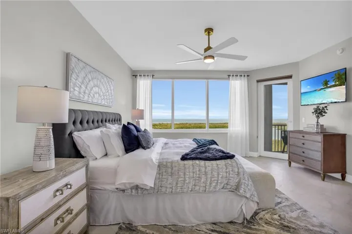 Bedroom with access to outside and ceiling fan